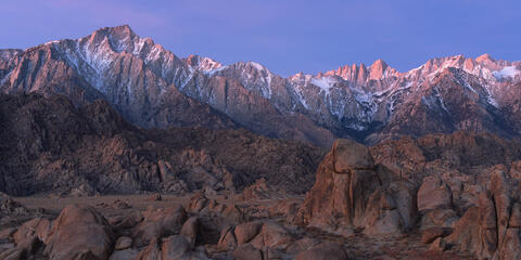 Mt. Whitney catch the first light of sunrise with Lone Pine peak to the left.